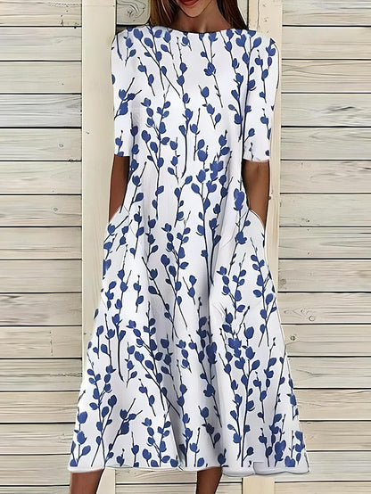 Linn | Veraniego vestido midi con escote redondo y estampado floral costero