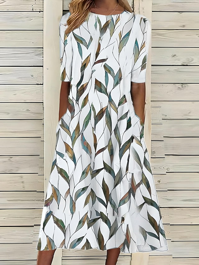 Linn | Veraniego vestido midi con escote redondo y estampado floral costero