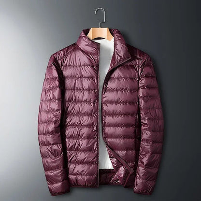 Chaqueta de plumón ultraligera para hombre: cálida, transpirable y azul oscuro.