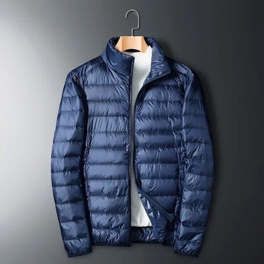 Chaqueta de plumón ultraligera para hombre: cálida, transpirable y azul oscuro.