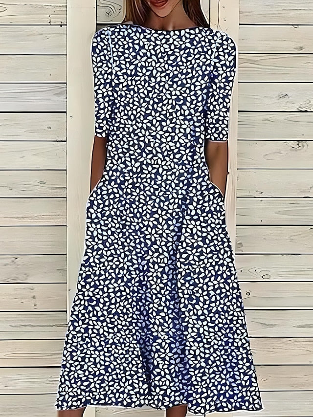 Linn | Veraniego vestido midi con escote redondo y estampado floral costero
