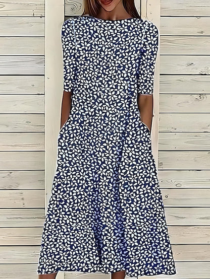 Linn | Veraniego vestido midi con escote redondo y estampado floral costero